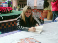 Susan Zeidler signing at an event